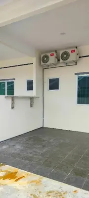 an empty garage with white walls and windows at Homestay odah dan hana teluk intan 3R2T in Teluk Intan