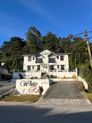 a white house on the side of a street at White rose Vila Taman sedia in Tanah Rata