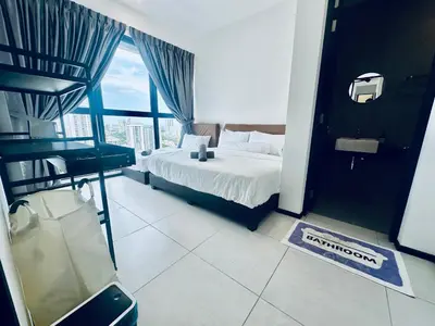 a bedroom with a bed and a large window at Urban Suites 3R2B 11pax Deluxe Living Room in George Town