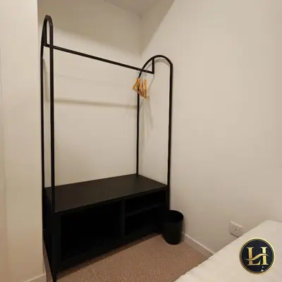 a closet with a black dresser in a room at The Stallionz Classy Suites by LH - Ipoh Town in Ipoh