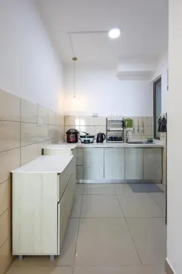 a kitchen with white cabinets and a white floor at Muji Style Top 5 Palas Horizon Brinchang Cameron Highlands - C Home Luxury A-5-04 in Brinchang