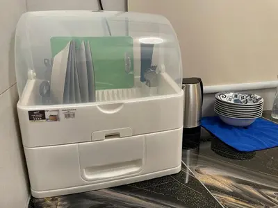a plastic container filled with utensils on a counter at Piccadilly Greentown Ipoh in Ipoh
