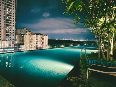 a large swimming pool on the roof of a building at Elegant 3BR Luxury City View Comfortable for 10 in George Town