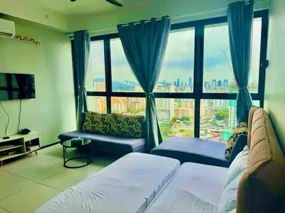 a bedroom with a large window with a view of a city at Elegant 3BR Luxury City View Comfortable for 10 in George Town