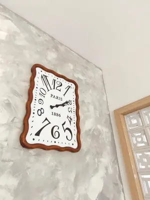a clock on top of a plastic wall at Ipoh Santorini Pool Villa 4BR 15pax by One Life Four Season Guesthouse in Ipoh