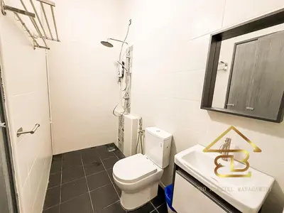 a bathroom with a toilet and a sink and a mirror at Ipoh Gunung Lang Mooncave Spacious 4BRHouse with 5 Queen Beds in Ipoh