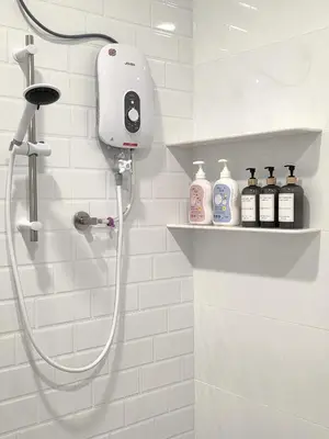 a bathroom with a shower with a shower head at Kidello Home Ipoh Indoor Private Playground in Ipoh