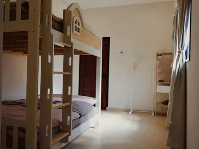 a bedroom with two bunk beds in a room at Kidello Home Ipoh Indoor Private Playground in Ipoh