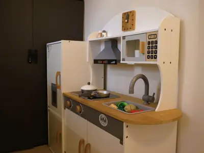 a toy kitchen with a sink and a microwave at Kidello Home Ipoh Indoor Private Playground in Ipoh