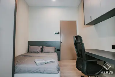 a small bedroom with a bed and a desk at Ipoh Midtown 33 Funhouse by Verve in Ipoh
