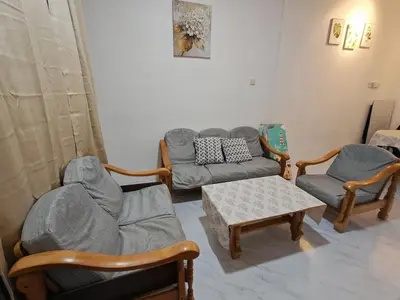 a living room with a couch and chairs and a table at Yoland Homestay Baling Kedah in Baling
