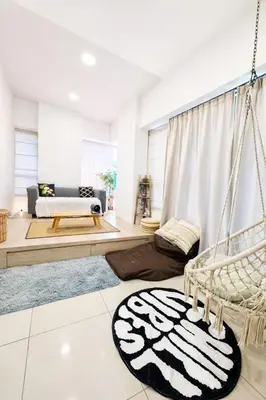 a living room with a swing and a bed at Private Apartment in Kuala Lumpur in Gua Sai