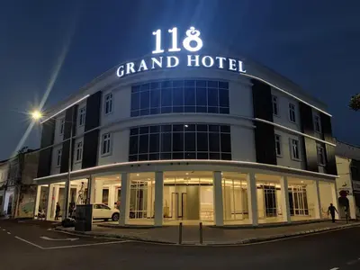 a grand hotel with a sign on top of it at 118 Grand Hotel in George Town