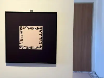 a framed picture on a wall in a room at N0ir Blanc Piccadilly Ipoh Town 3R2B 6-7pax in Ipoh
