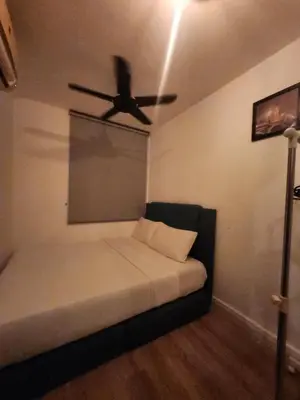 a room with a bed with a ceiling fan at The Majestic Condo Ipoh in Ipoh