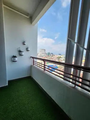 a balcony with a view of a city at The Majestic Condo Ipoh in Ipoh