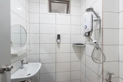 a white bathroom with a shower and a sink at Serene Minimalist Family Retreat 2-7pax 8 min to BoH in Brinchang