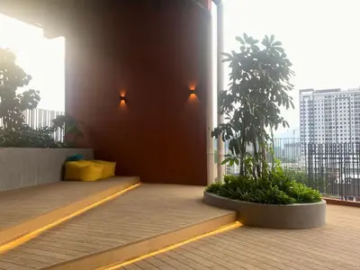 a balcony with a view of a city from a building at The Piccadilly Greentown Residences Ipoh in Ipoh