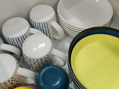 a group of cups and plates on a counter at Mansion One Studio VIP Parking Gleneagles Gurney in George Town
