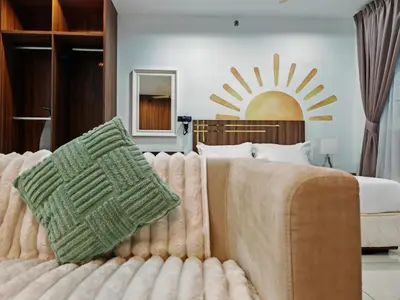 a bedroom with a bed with a couch next to a bed at Mansion One Studio VIP Parking Gleneagles Gurney in George Town