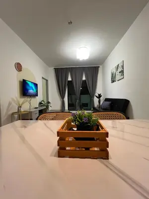 a table with a wooden crate with flowers on it at Mutiara Homestay cameron in Tanah Rata
