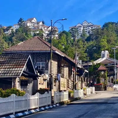a row of houses on the side of a street at A321 Silverpark Resort 1 lifted & Mountain view in Bukit Fraser