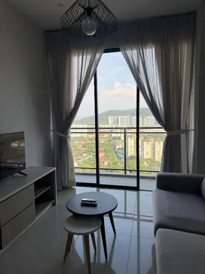 a living room with a table and a large window at Homey Studio Unit Relaxing Stay at Bayan Lepas in Gua Sai