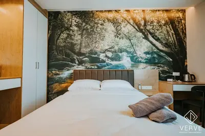 a bedroom with a painting on the wall at Ipoh Town Area Avs Hotel by Verve in Ipoh