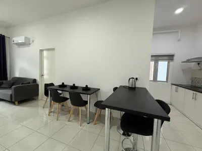 a living room with a table and chairs at 3pax Suite Ipoh Town The Anderson Residence #147 in Ipoh