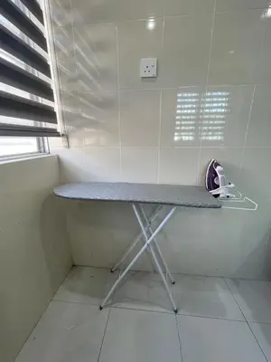 a table in the corner of a room at Afiq's Homestay, Manjung in Seri Manjung