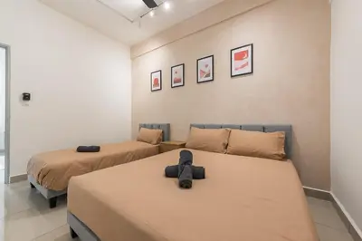 two beds in a room with two beds at Serene Japandi & Zen Family Retreat 2-7 pax with Comfortable Living Space in Tanah Rata