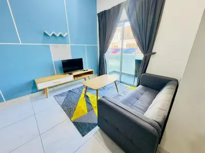 a living room with a couch and a table at Icolor Ch 7 in Tanah Rata