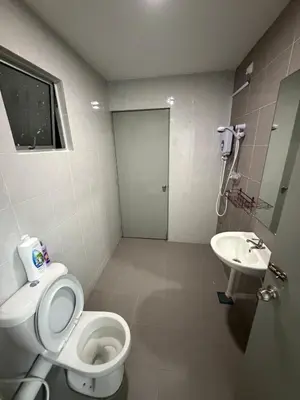 a bathroom with a toilet and a sink at B-Ulike-HomeStay-3Room-TheVenus in Sitiawan