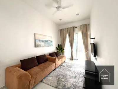 a living room with a couch and a television at Ipoh Musllim Homestay Meru Tropika - 3 Bedrooms in Ipoh