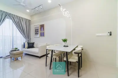 a living room with a table and a couch at JOMSTAY - Piccadilly Greentown Ipoh in Ipoh