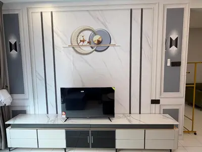 a room with a table with a television on it at Ayaan Platinum2 Homestay at Tanah Rata with Private Parking and Air Hockey Games in Tanah Rata