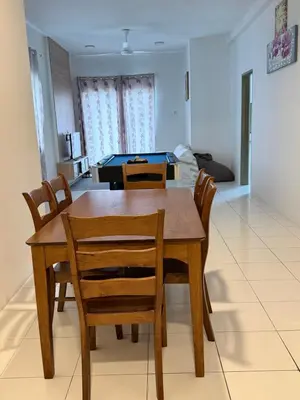 a dining room with a table and chairs at AYAAN Freesia Snooker House at Quintet Private Parking in Tanah Rata