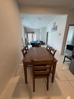 a dining room with a wooden table and chairs at AYAAN Freesia Snooker House at Quintet Private Parking in Tanah Rata