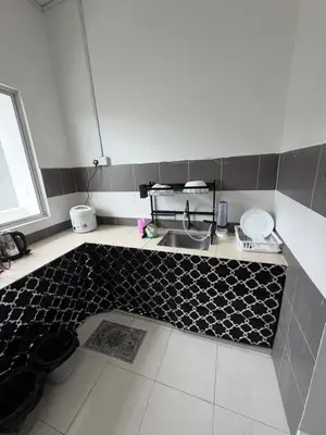 a kitchen with a sink and a tile floor at AYAAN McQUEEN Featured House with ps3 experience Most Wanted 2012 Racing games in Tanah Rata