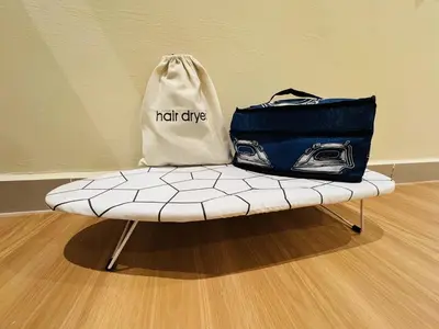 two bags sitting on top of a bench at Homestay Cozy Dino Cameron Highlands in Tanah Rata