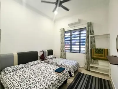a bedroom with two beds and a ceiling fan at Scafie apartment 001