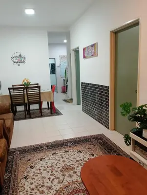 a living room with a couch and a table at RIADAH DALAM IBADAH by Rumah Che Matsunami in Brinchang