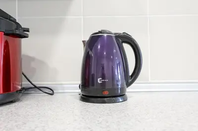 a tea kettle is sitting on a kitchen counter at Top 2 Palas Horizon Brinchang Cameron Highlands in Brinchang