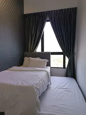 a bedroom with a large bed and a window at LMS ipoh town in Ipoh