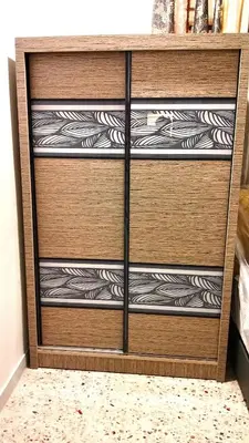 a wooden dresser with four shelves in a room at A K Homestay in Sungai Petani