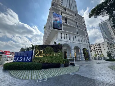 a building with a sign in front of it at Lovecozy Home 22M Macalister in George Town