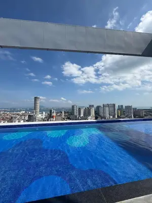 a large swimming pool with a view of a city at Lovecozy Home 22M Macalister in George Town
