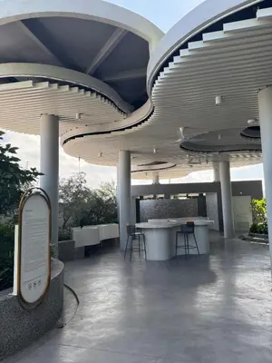 a lobby with tables and chairs in a building at Lovecozy Home 22M Macalister in George Town