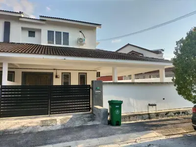 a white house with a black fence and a trash can at Lahat Homestay in Lahat