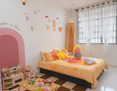 a childs bedroom with a bed with toys on it at Cozy Homestay 6-10pax Double storey in Bukit Mertajam